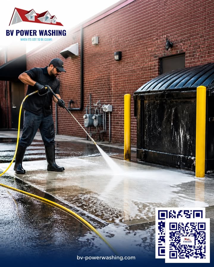 Blackstone Valley Power Washing technician cleaning a commercial dumpster pad